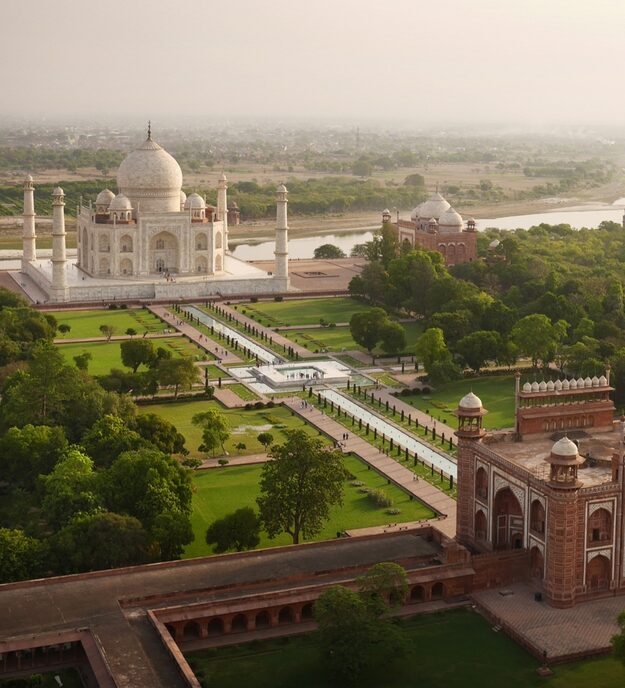 Taj Mahal as the day's first tourists trickle through the gates.